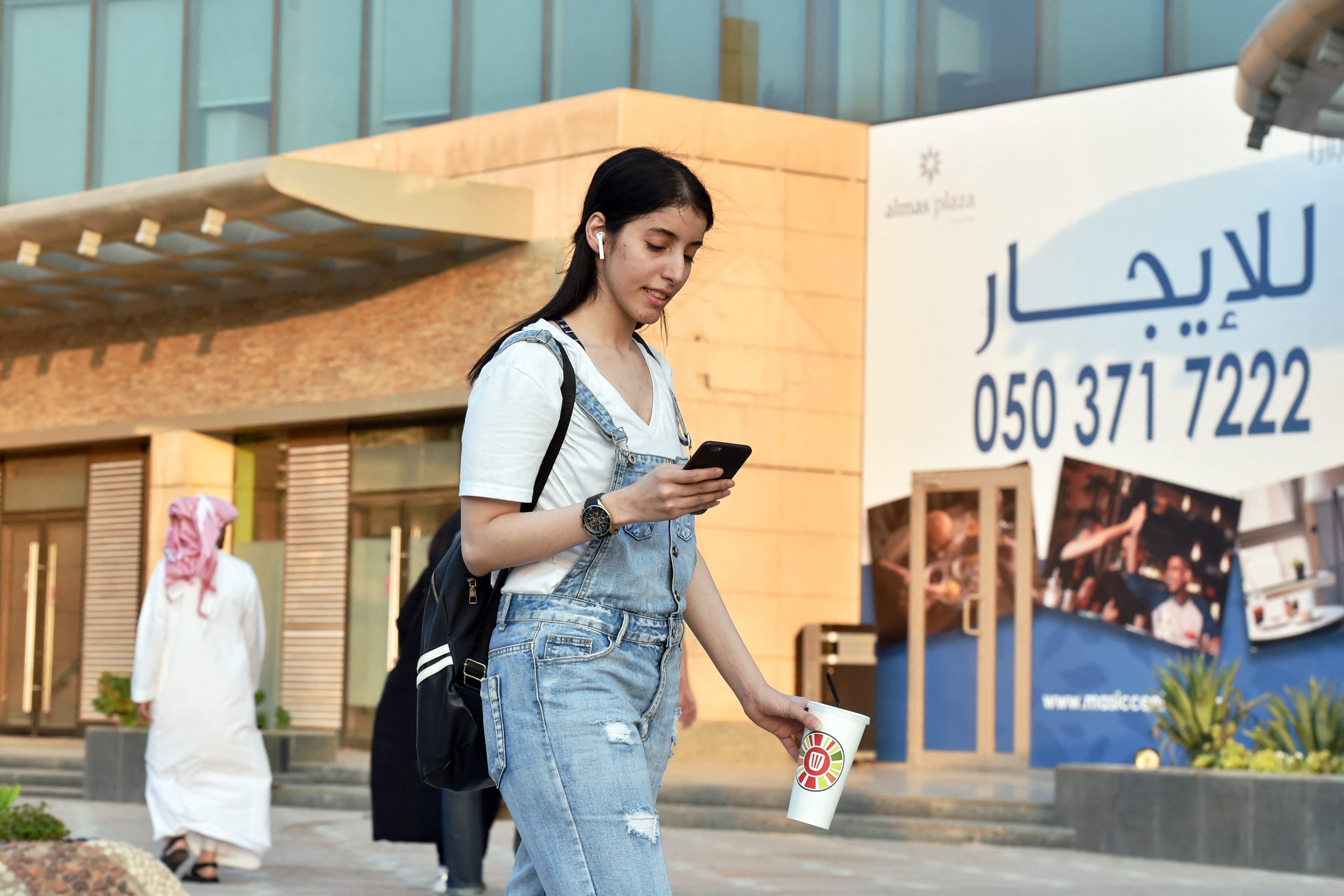 Manahel al-Otaibi walks the streets of Riyadh in western clothing in 2019